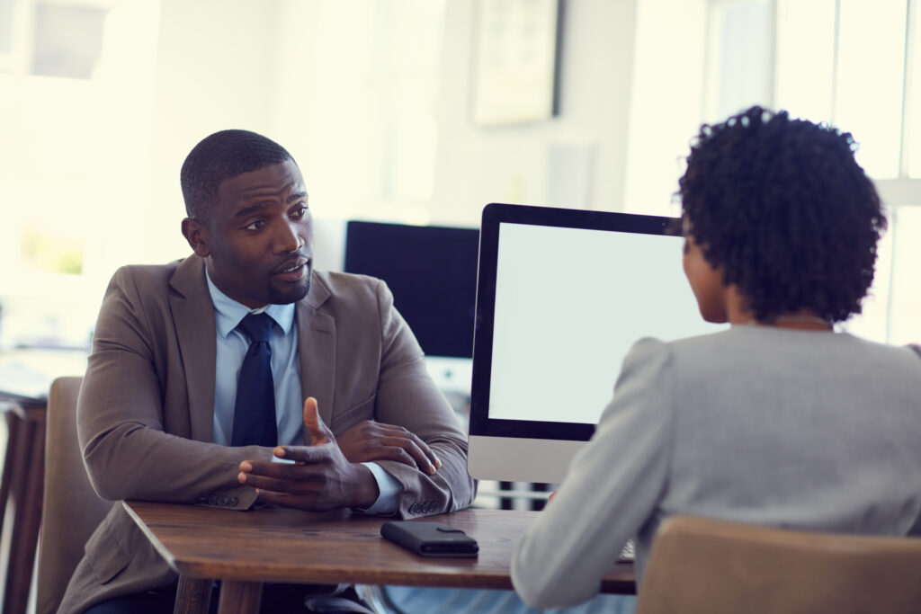 a black man and woman in a job interview session.